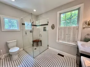 Modern farmhouse located on 53 acres of manicured rolling hills. - Image 4