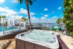 Aquatopia North: Riverfront beach house, w/ dock, heated pool + hot tub & more! - Image 3