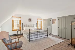 Central Escape is a spacious Lakes Region retreat just 5 minutes from downtown Meredith, less than a mile to Squam Lake and 20 minutes to concerts at the Bank of New Hampshire Pavilion. Enjoy the private year-round hot tub, fire pit, yard games! - Image 5