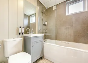 Luxurious lodge with vaulted ceilings and a welcoming feature fireplace. - Image 2