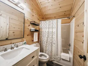 Cabin #6: Studio style layout with kitchenette and a large gravel parking pad beside the cabin for easy boat or trailer storage. - Image 3