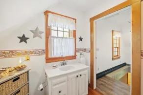 Central Escape is a spacious Lakes Region retreat just 5 minutes from downtown Meredith, less than a mile to Squam Lake and 20 minutes to concerts at the Bank of New Hampshire Pavilion. Enjoy the private year-round hot tub, fire pit, yard games! - Image 4