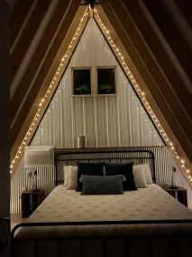 King bed in Tulip Glamping Aframe at Noble Pine Campground - Image 2