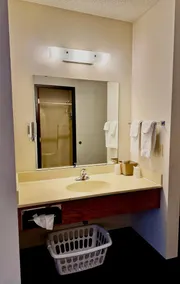 Two queen beds, private bathroom, mini fridge, and single-serve coffee maker. - Image 3