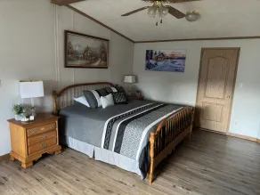 King size bedroom/ Outdoor fire pit, Game Room. Cozy getaway cottage - Image 5