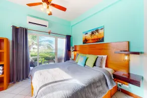 Vibrant, colorful lagoon-front suite with pool access, scenic patio, & W/D - Image 5