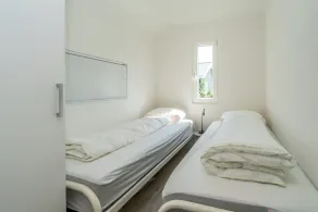 This chalet has an extra spacious living room and two sitting areas, one of which is situated by the - Image 5