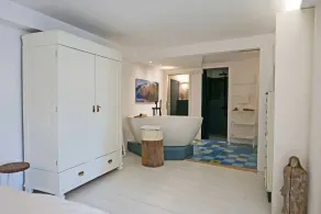 Our high-quality vacation apartment \"Hafenheimat\" welcomes you in a casual Scandinavian style with a direct view of the Schlei, the sailing harbor and the herring fence, as well as the apartment's own terrace, from where you can watch the hustle and bustl - Image 2