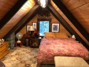Luxurious secluded rustic wooden chalet on edge of tranquil pond next to beach. - Image 2
