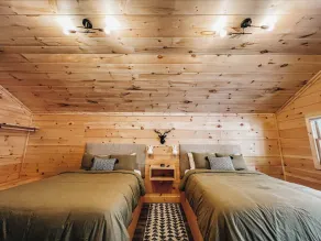 Cabin #6: Studio style layout with kitchenette and a large gravel parking pad beside the cabin for easy boat or trailer storage. - Image 5