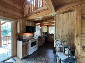 Relax at The Lincoln Log Cabin perched along the Jump River. - Image 3