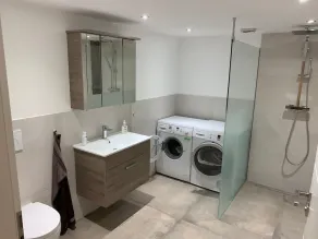 First floor vacation apartment on approx. 78 sqm, high-quality and modern furnishings with furnished terrace with garden pond and barbecue facilities, covered e-bike charging station and lockable bicycle room. You can look forward to: a fully equipped... - Image 2