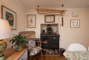 A cosy cottage with a woodburner - Image 5