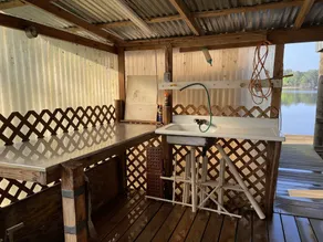 Take a break and unwind on our waterfront screened in porch - Image 5