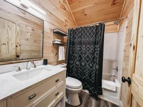 Cabin #1: Studio style layout with kitchenette and a large gravel parking pad beside the cabin for easy boat or trailer storage. - Image 2