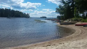 ⁷Tranquil Sandy beach, launch, dock, lawn games and firepit. - Image 4