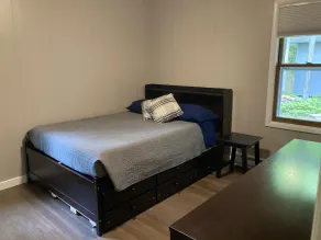 Retreat on a wooded lot within walking distance of downtown! - Image 4