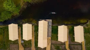 Combined tents with kitchen and bathroom located near a pond - Image 5