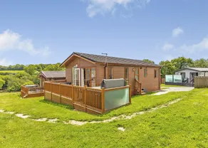 Escape to the Jasmine Lodge, nestled amidst stunning rolling countryside. - Image 3