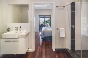 A stylish and modern home, situated in manicured gardens. - Image 2