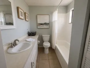 Bright 2-bed, 1-bath condo in the heart of Indian Rocks Beach, just a 2-min walk to the sand and steps from local cafés & shops. Enjoy a shared POOL, private balcony, washer/dryer, free parking — ideal for couples, friends, families & pet-friendly! - Image 3