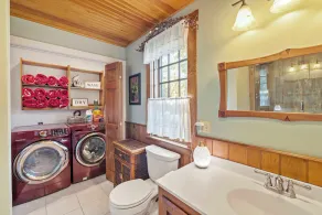 Central Escape is a spacious Lakes Region retreat just 5 minutes from downtown Meredith, less than a mile to Squam Lake and 20 minutes to concerts at the Bank of New Hampshire Pavilion. Enjoy the private year-round hot tub, fire pit, yard games! - Image 3