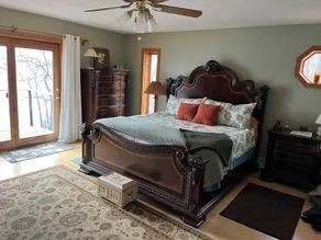 Waterfront retreat on 7 private wooded acres with beautiful sunset views. - Image 3
