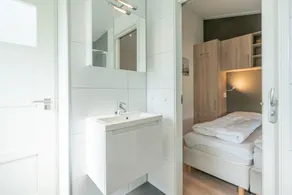 You are guaranteed to unwind and relax in one of the chairs or on the comfy sofa in the central livi - Image 4