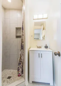 This centrally located 3 bedroom 2 bathroom features a full size pool and electric vehicle charging on site. - Image 2
