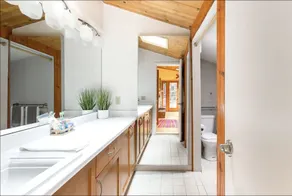 Cabin Nestled in Forested Canyon - Image 3