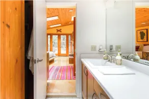 Cabin Nestled in Forested Canyon - Image 4