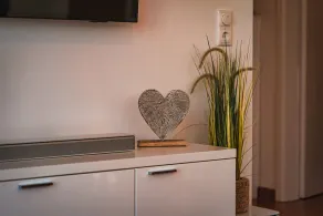 Windrose 9 Modern Vacation Apartment in Großenbrode. A TV with an impressive audio and visual experience. Pure relaxation with a sauna and corner bathtub. Washer and dryer for added convenience - Image 2