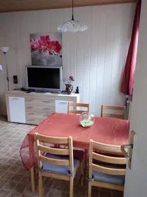The apartment has about 40 square meters of living space and is equipped with a kitchen, dining area (for 4 people) and a sofa bed and TV. - Image 5