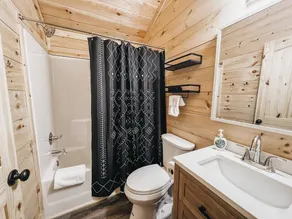 Cabin #9: One king-size bed, a kitchenette, and a large gravel parking pad beside the cabin for easy boat or trailer storage. - Image 2