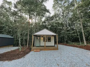 Cabin #1: Studio style layout with kitchenette and a large gravel parking pad beside the cabin for easy boat or trailer storage. - Image 5
