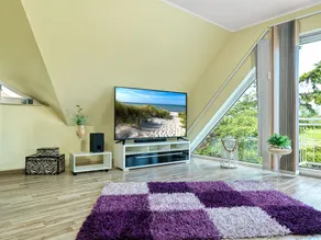 This holiday home has a living space of 110 m², sleeps up to 6 people, two parki - Image 3