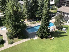 Indoor pool, sauna, outdoor pool, tennis court, covered parking lot, fitness room  - Image 4