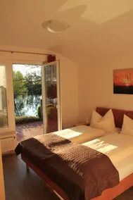 Gemütlich eingerichtete Appartements, barrierefrei mit großer Terrasse am See - Image 4
