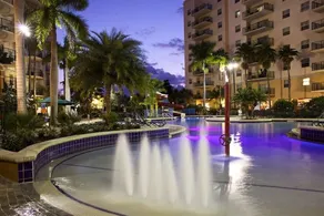 Relax at our Palm Tree secluded Resort with a poolside bar and waterslide - Image 3