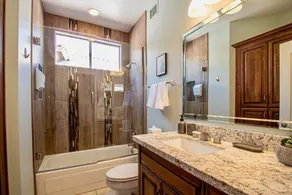 Relax and recharge at this stylish desert retreat with views of rolling desert hills. Enjoy sunsets from the heated pool, dine outdoors, or unwind with a few on the putting green. Perfect for long stays—just 15 minutes from the airport! - Image 5