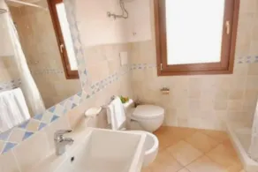 Studio apartment for 3 people of 30 m2 furnished in Sardinian style.Located on the ground floor with veranda and small garden or first floor with balcony.Consisting of living room with kitchenette, 2 joinable single beds, single sofa bed, bathroom.Endowe - Image 2