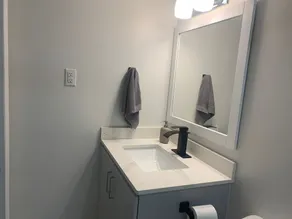 One bedroom ensuite toilet on main level & kitchen, living, bathroom lower level - Image 5