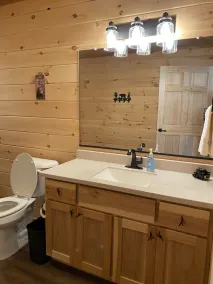 Relax in our secluded hot tub overlooking the pond with a glass of wine in Luray - Image 4