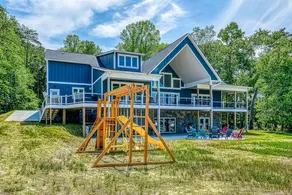 Dog-friendly lakefront home with a game room, children's items, and firepit - Image 2