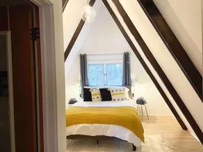 Cozy Vermont A-frame on a quiet private road, minutes from Stratton. Enjoy year-round adventure, then unwind in the hot tub under the stars. Spacious, stylish, and perfect for groups seeking both relaxation and outdoor fun. - Image 3