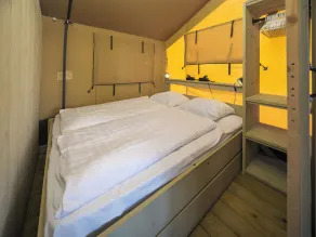 Experience luxury glamping in the elevated Safari Tent Ranger by the water. - Image 5