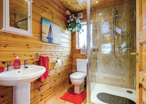 Set in a peaceful location and perched over the lake. - Image 2
