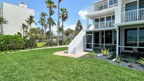 LaPlaya 101A - Step out to the beach from your screened lanai. Light and bright end unit. - Image 4