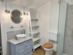 Boutique Shepherds Hut set in a wildflower meadow on a farm with Highland Cows - Image 2