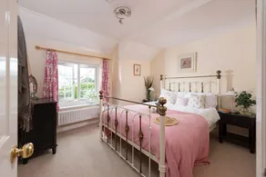 A cosy cottage with a woodburner - Image 4